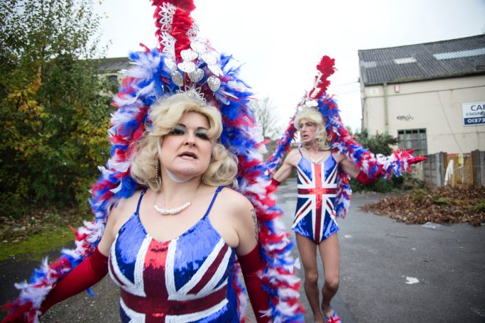 2 women in drag wearing Union Jack headdresses and outfits